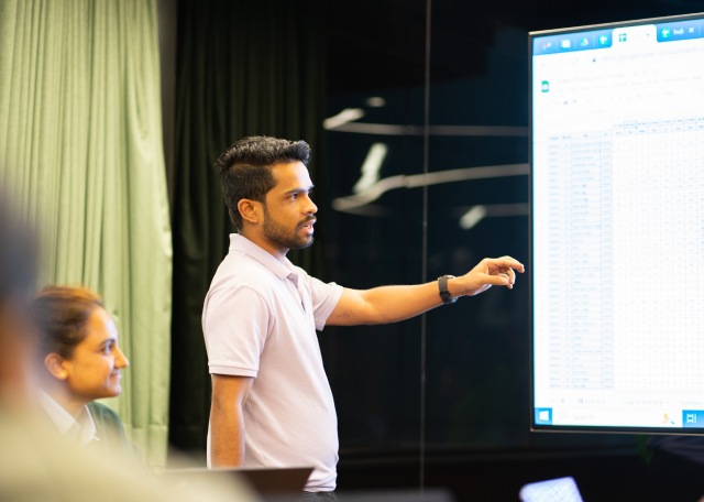 Employee presenting ideas on a whiteboard